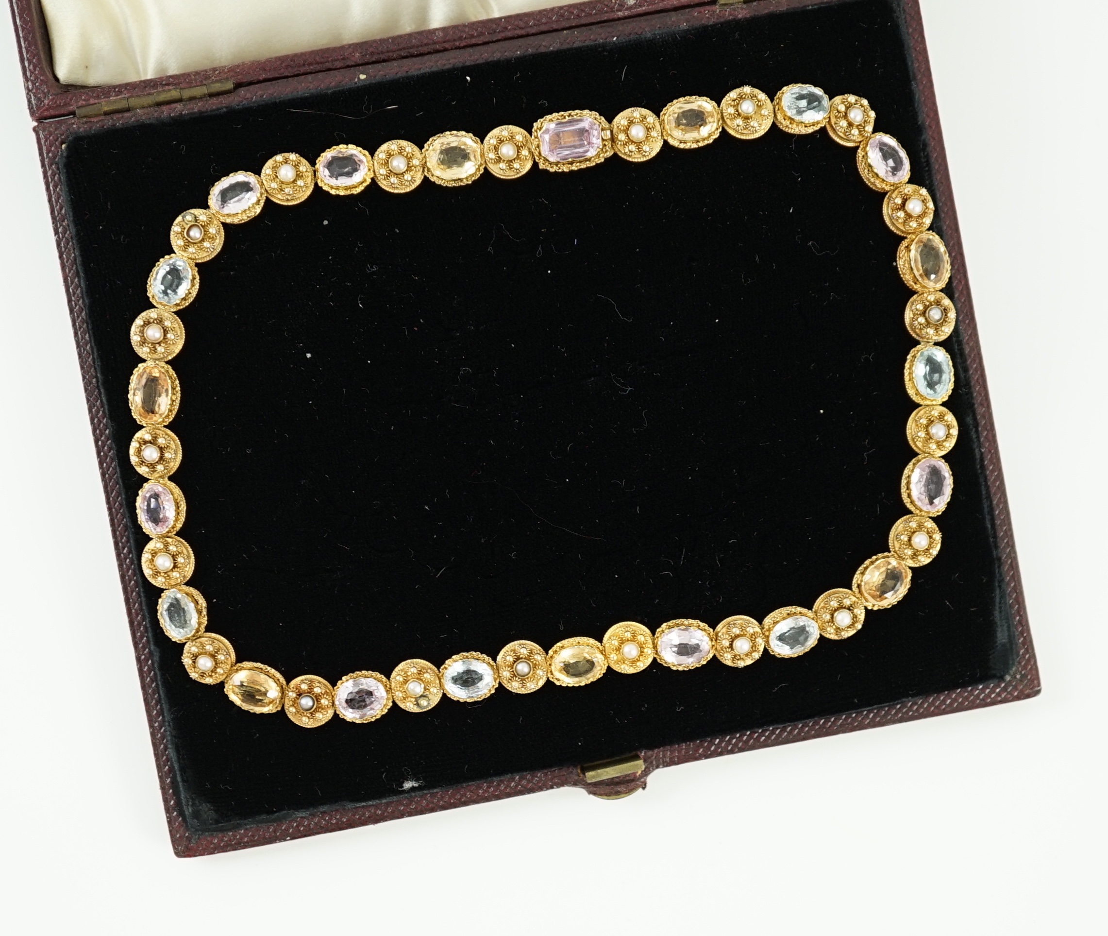 A 19th century gold, pink topaz, seed pearl, citrine and aquamarine set choker necklace